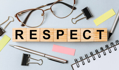 RESPECT word on wooden cubes on office desk