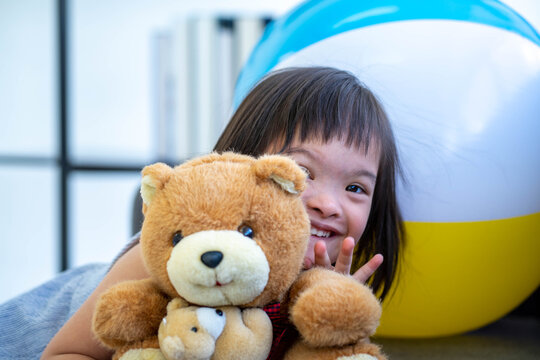a child with autism spectrum disorder playing in therapy session living room new normal