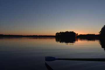 red sunset on the lake in calm