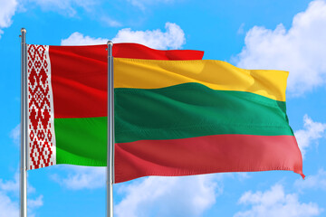 Lithuania and Belarus national flag waving in the windy deep blue sky. Diplomacy and international relations concept.