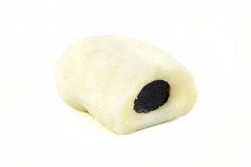 White marzipan candy with liquorice inside, isolated on a white background.