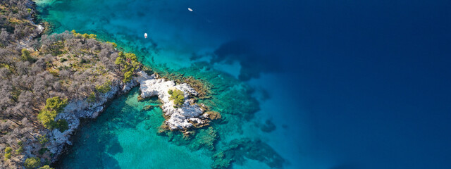 Naklejka na ściany i meble Aerial drone ultra wide panoramic photo of tropical paradise deep turquoise lagoon with beautiful seascape in exotic destination island