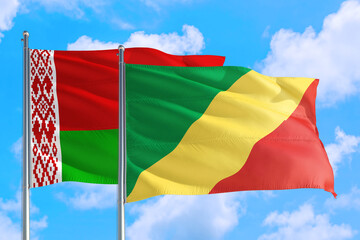 Republic Of The Congo and Belarus national flag waving in the windy deep blue sky. Diplomacy and international relations concept.
