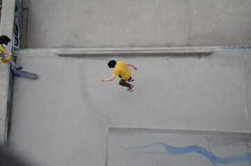 Boy doing skateboarding.