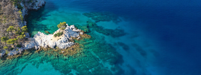 Aerial drone ultra wide panoramic view of tropical paradise sandy beach visited by sailboats and yachts in Caribbean exotic destination island