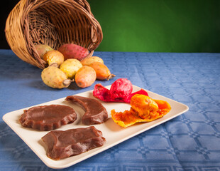 Prickly pears and sicilian mostarda on a table with a wicker basket