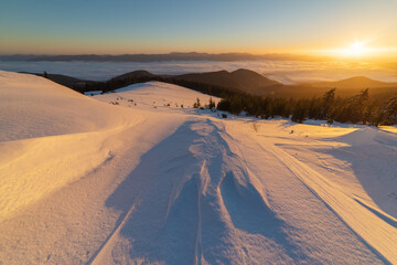 Winter in the Ukrainian Carpathian mountains with morning fogs