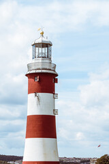 Fototapeta na wymiar The iconic candy coloured lighthouse at Plymouth Hoe, Devon