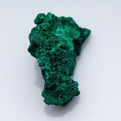 Malachite green ore on a white background. Natural green malachite