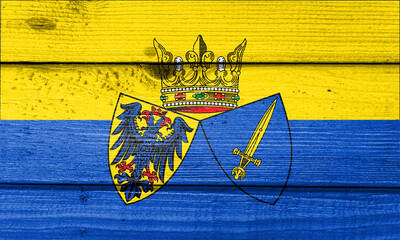 essen flag painted on old wood plank background. Brushed natural light knotted wooden board texture. Wooden texture background flag of essen