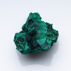 Malachite green ore on a white background. Natural green malachite