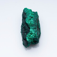 Malachite green ore on a white background. Natural green malachite
