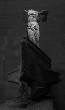 Paris, France - April 26, 2015: A black and white picture of the sculpture Nike of Samothrace, in the Louvre.
