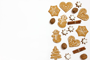 Christmas background with gingerbread, cinnamon sticks and nuts