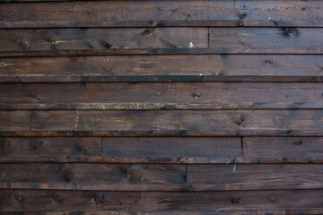 The texture of the boards is dark brown.