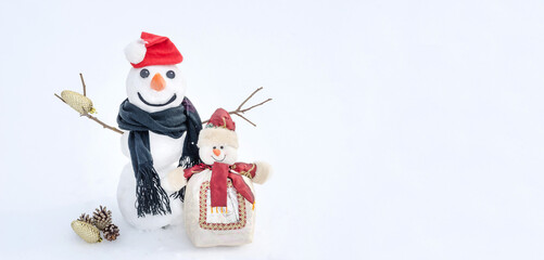 Christmas and New Years background card with copy space, snowmen on a snow background