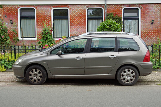 Pieterburen, the Netherland - July 16, 2020: Peugeot 307 SW parked on a public parking lot. Nobody in the vehicle.