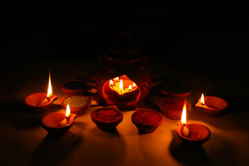 Happy Diwali diya, Diwali celebration with lights, Oil lamp on traditional tray, Clay diya with lineHappy Diwali diya, Diwali celebration with lights, Oil lamp on traditional tray, Clay diya with line
