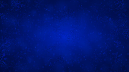 Christmas background of snowflakes of different shapes, sizes and transparency in blue colors