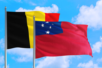 Samoa and Belgium national flag waving in the windy deep blue sky. Diplomacy and international...