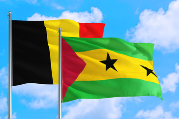 Sao Tome And Principe and Belgium national flag waving in the windy deep blue sky. Diplomacy and international relations concept.