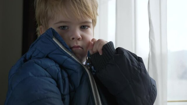 Cute Child Fastens Jacket with a Zipper. Little Boy Wearing Winter Attire Zipping with Zip-fastener. 2x Slow motion 60 fps 4K