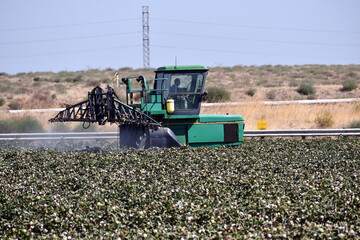 Side of sprayer tractor for cotton