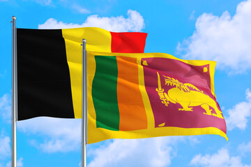 Sri Lanka and Belgium national flag waving in the windy deep blue sky. Diplomacy and international relations concept.