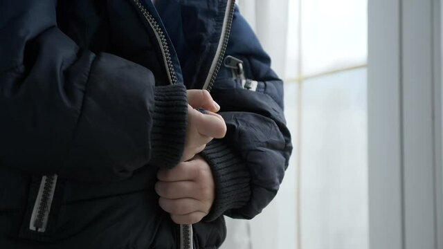 Cute Child Fastens Jacket with a Zipper. Little Boy Wearing Winter Attire Zipping with Zip-fastener. 2x Slow motion 60 fps 4K