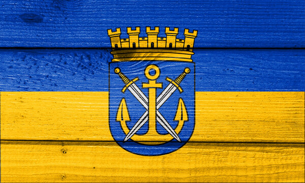 Solingen flag painted on old wood plank background. Brushed natural light knotted wooden board texture. Wooden texture background flag of Solingen