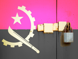 Angola flag is on texture. Template. Coronavirus pandemic. Countries may be closed. Locks.