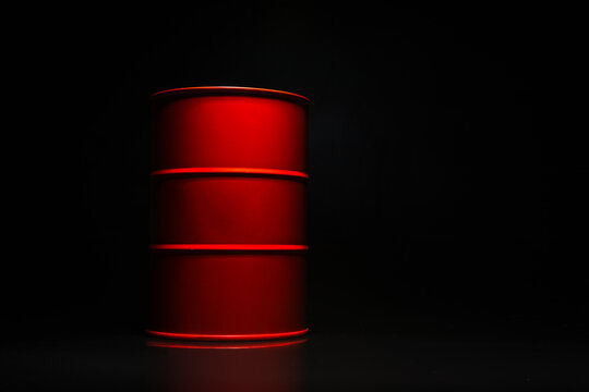 Red barrel of oil on a black background.