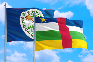 Central African Republic and Belize national flag waving in the windy deep blue sky. Diplomacy and international relations concept.