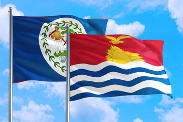 Kiribati and Belize national flag waving in the windy deep blue sky. Diplomacy and international relations concept.