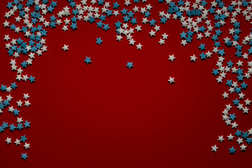 red christmas background with white and blue stars