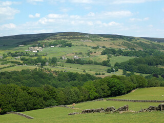 Fototapeta na wymiar panoramic view across the calder valley in west yorkshire with midgley moor village and farmhouses in summer