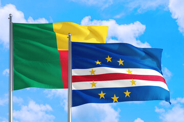 Cape Verde and Benin national flag waving in the windy deep blue sky. Diplomacy and international relations concept.