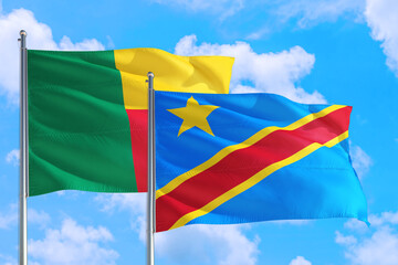 Congo and Benin national flag waving in the windy deep blue sky. Diplomacy and international relations concept.