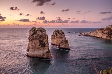 Fototapeta premium Lebanon, Beirut- Sunset over the Raouche Rocks