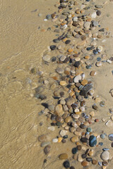 Fototapeta na wymiar Stone washed up on the beach