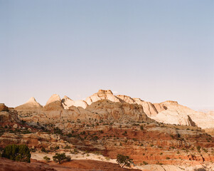 sunset over desert cliffs