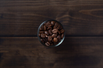 Top view of coffee beans in small glass
