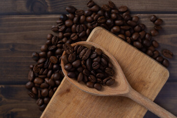 Top view of coffee beans on wooden board