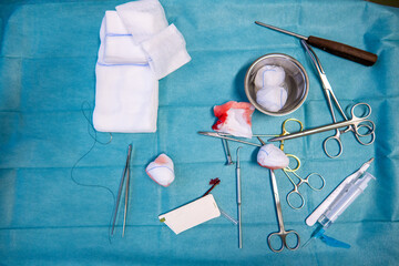 the used sterile instruments are on an operating table after screw removal