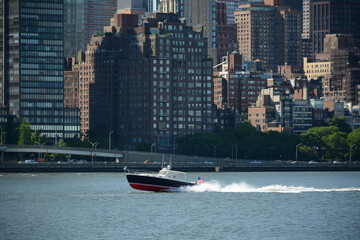 New York, USA - June 3, 2019: View on the speed boat from Gantry Plaza State Park in Queens