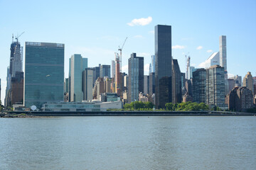 Fototapeta na wymiar New York, USA - June 3, 2019: View to Manhattan from Gantry Plaza State Park in Queens