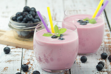 Two glasses with blueberry yogurt