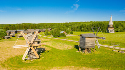 Russian wooden village with a mill of the 19th century preserved to this day