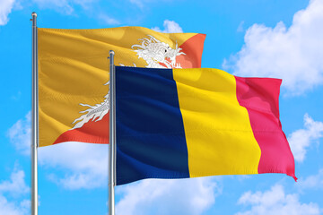 Chad and Bhutan national flag waving in the windy deep blue sky. Diplomacy and international relations concept.