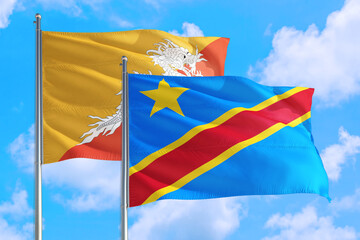 Congo and Bhutan national flag waving in the windy deep blue sky. Diplomacy and international relations concept.